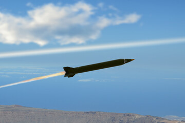 Missile in flight over mountain landscape with fiery trail in sky © Anelo