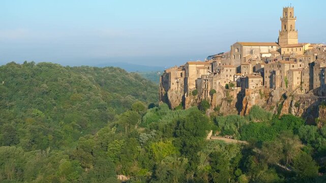 Scenic view of pitigliano town in tuscany italy. Beautiful panoramic view of the ancient town of pitigliano, built on a tuff rock cliff lush green valley in the grosseto province of tuscany, italy