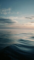Obraz premium Serene Ocean Sunset with Gentle Waves