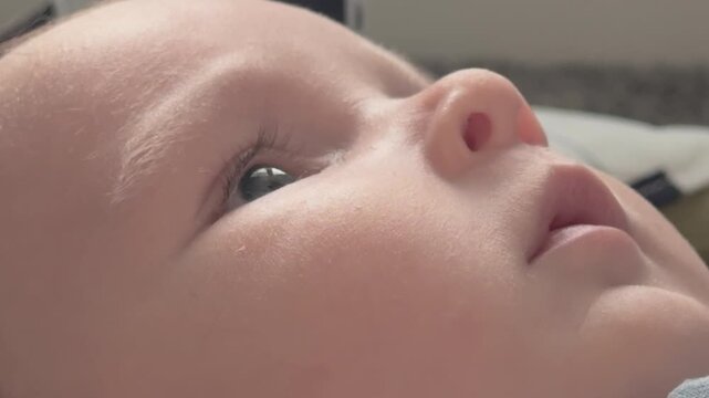Close up of babies face while he plays 4k
