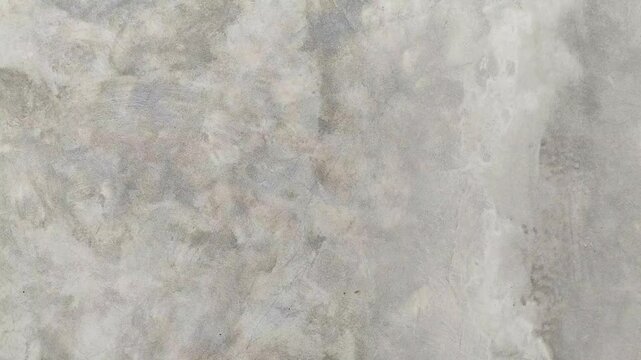 Minimalist industrial grey concrete wall background featuring a smooth subtle marble and organic patterns. Perfect for backgrounds, text overlays, product mockup and modern loft aesthetic.