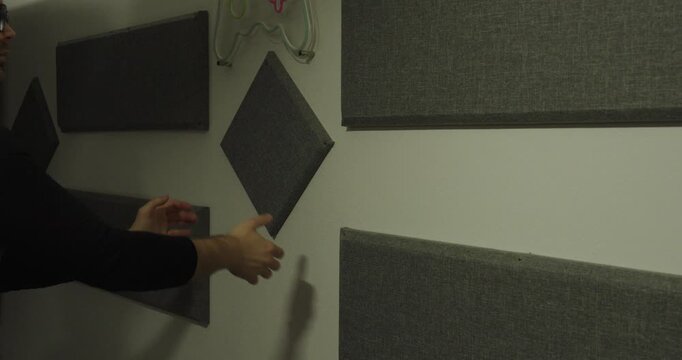 Man Clapping Hands to Test Room Acoustics &ndash; Echo and Sound Reflection