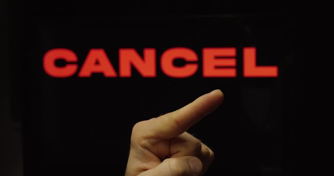 Finger Pressing Cancel Button on Screen &ndash; Rejection Decision Concept