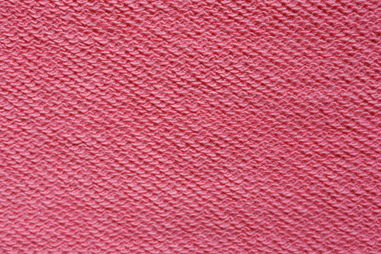 Bright pink french terry loopback fabric texture macro textile background