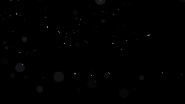 Subtle light particles floating gently on black background creating an abstract motion overlay