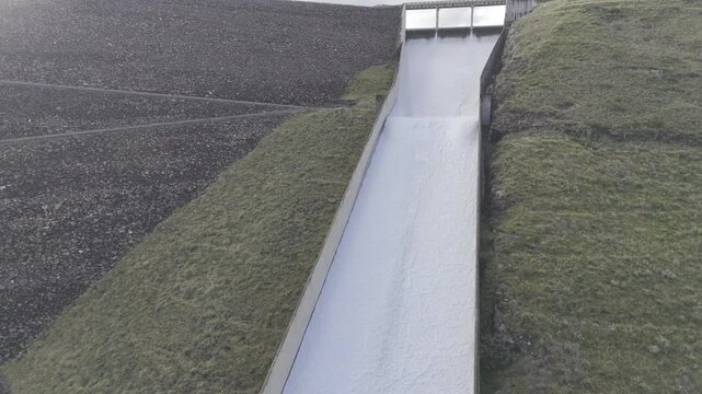 Drone hovers halfway up spillway of Mohale Dam on a late afternoon in the mountains of Lesotho
