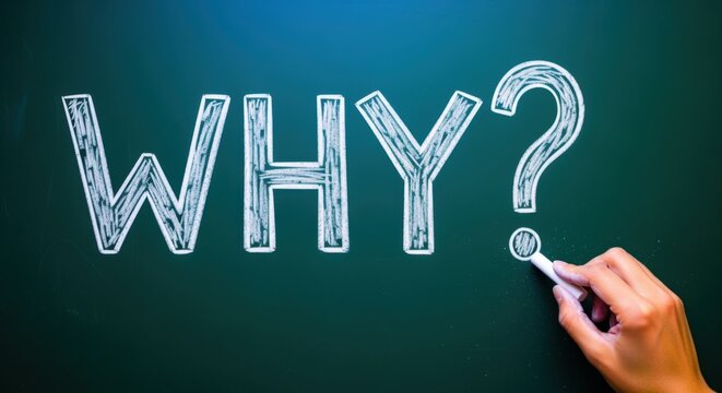 Large Chalkboard displaying the word WHY with a question mark, drawn with chalk by a hand holding a chalk stick