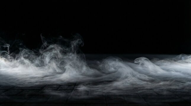 Cinematic low lying fog rolling across dark paved floor with moody lighting effect.