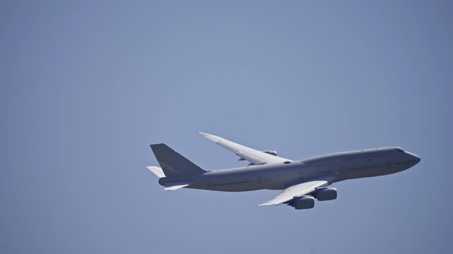 Large Cargo Military Freighter Airplane Profile Tracking Shot in Sky.