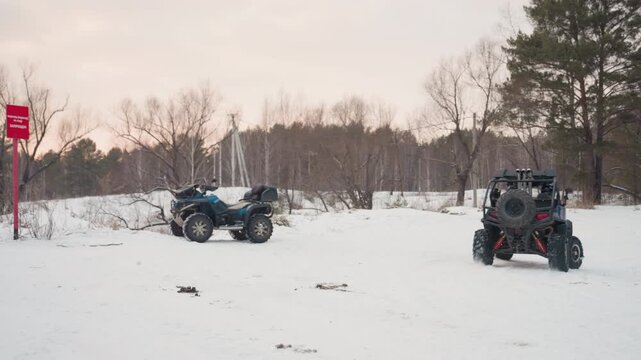 Frozen bay with ATV and snow. Winter landscape featuring ATV and red marker in snow. Serene winter scenery showcasing ATV parked on snowcovered area near frozen bay with red marker