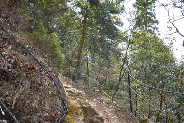 Obraz premium Mountain Trekking Path with Protective Wire Mesh and Fence