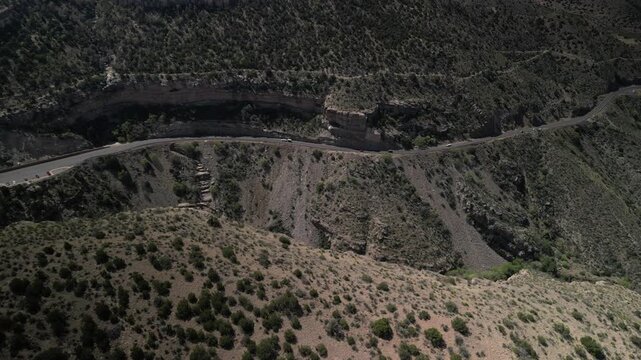 Aerial desert cliffs and state highway 82 in High Rolls New Mexico