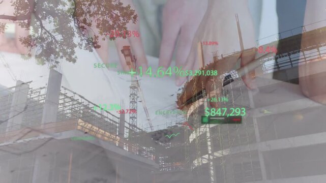 Reviewing hands with light sleeves manipulating plans on construction site, with financial overlays