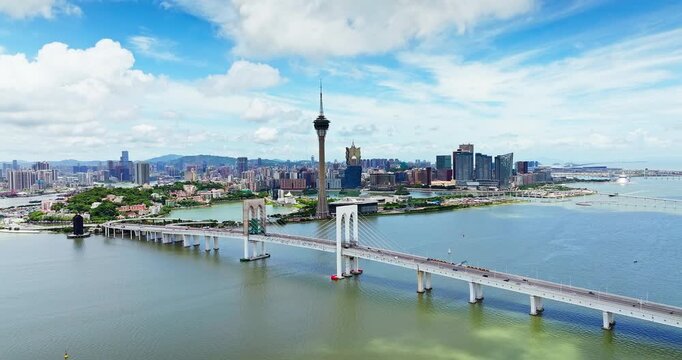 Aerial view of Macau Tower and Sai Van Bridge against the city skyline, Macau, China