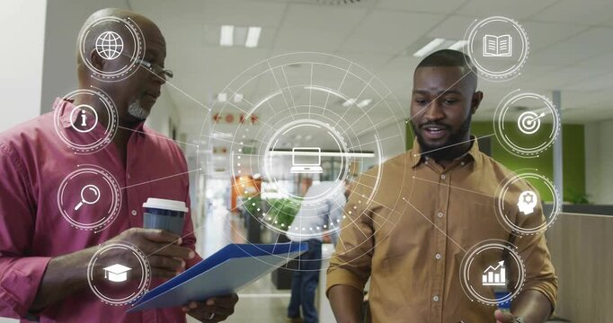 Senior man opening blue folder explaining while mentee nodding HUD overlaying office for business