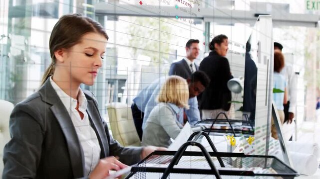 Admin typing and filing at business reception desk, team pointing at glass board sparking planning