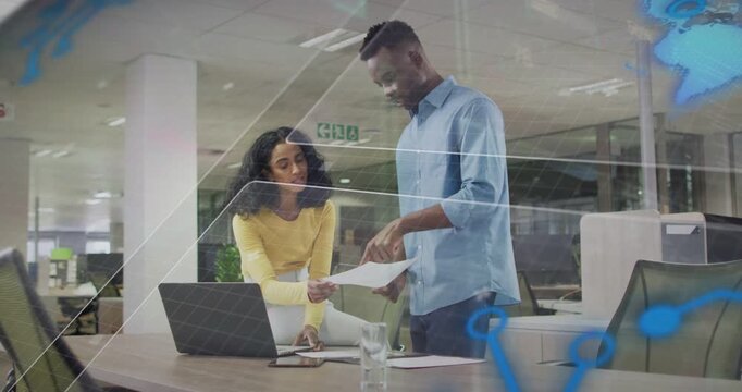 Vertical video: Handing paper, woman yellow urging man blue pointing at laptop overlay office