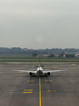 Airplane parked on the runway at Milan Malpensa Airport