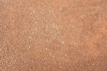 Dirt, terrain or gravel stone road surface pattern in outdoor environmental. Background and textured photo. © Nattawit