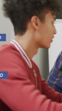 Vertical video: Man sitting right, incoming social badges floating over red jacket for marketing