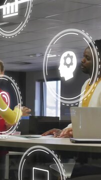 Vertical video: Team talking papers, gesture sparking hand stacking showing unity, icons floating