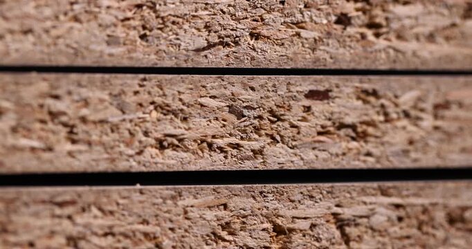 Wood sheets in a bundle, compressed wood sheets with light fibers and deep shadows between layers with clear surface details and realistic rough texture.