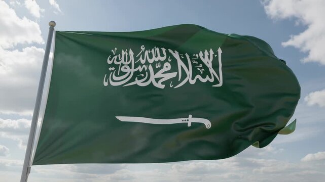 Saudi Arabia national flag waving against blue sky with clouds symbol of Middle Eastern country