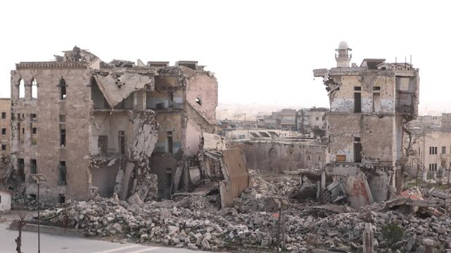 panoramic view of the massive stone entrance and defensive towers of the ancient Citadel of Aleppo