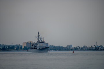 Naval Ship in Harbor with City Skyline © Oasis23