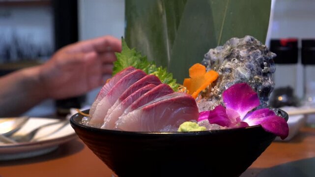 Chopsticks eating hamachi sashimi yellowtail raw fish japanese food