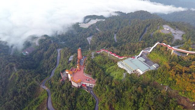 Aerial view of Chin Swee Caves Temple nestled in vast greenery, Malaysia