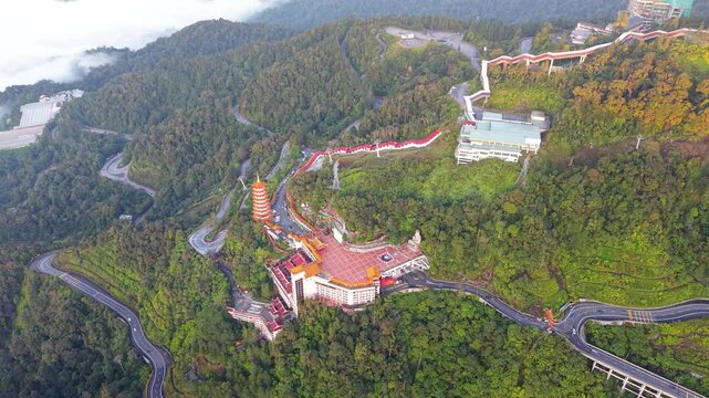 Aerial view of Chin Swee Caves Temple nestled in vast greenery, Malaysia