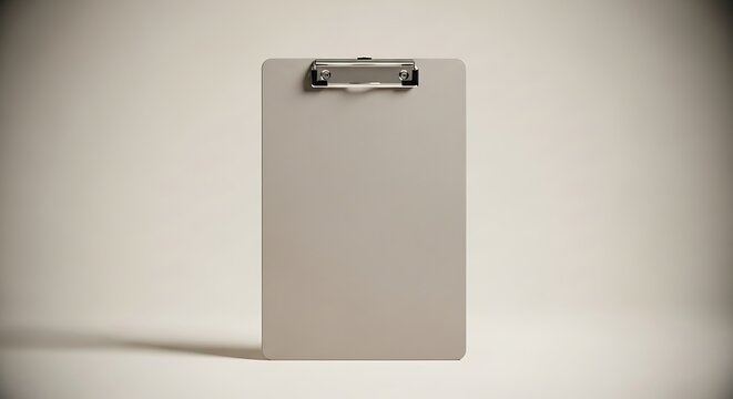 Blank clipboard with metal clip on a white background, ready for notes and documents.