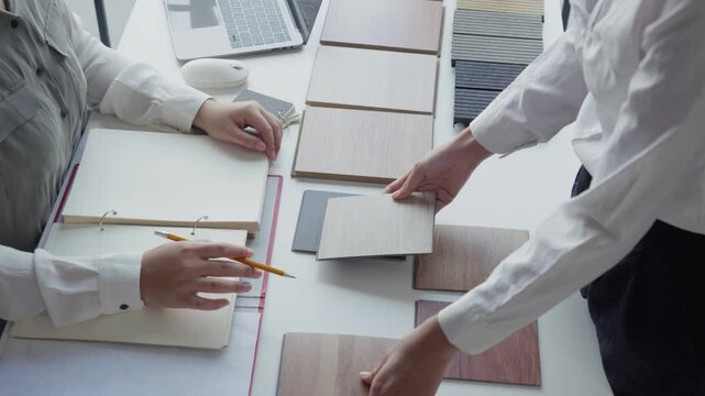 Two Interior Designers Collaborating in Office