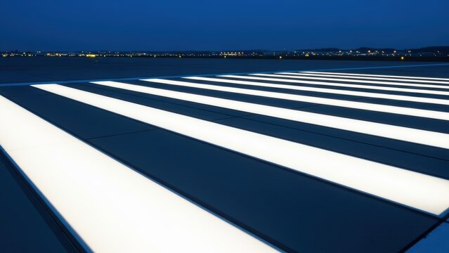 illuminated airport runway markings at night