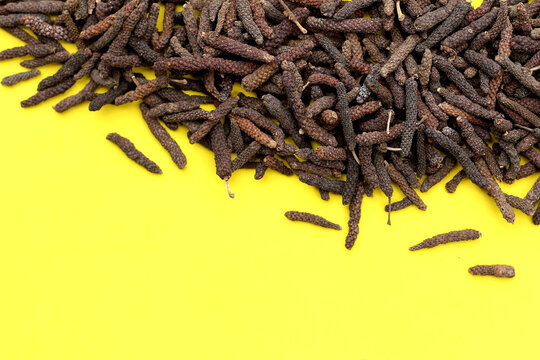 Long pepper (Piper longum), a spice used in traditional medicine and cooking, known for its pungent flavor.