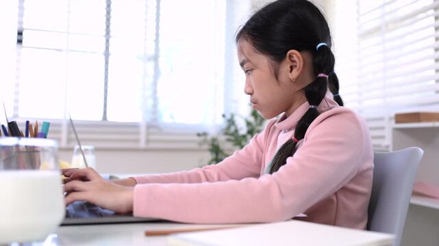 Education learning homeschool technology, Asian girl using laptop doing homework, remote digital, modern education, discipline skill, dairy milk with healthy kid, alpha generation elementary students