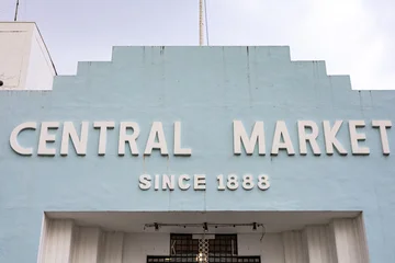 Fototapeten Kuala Lumpur Close-up of the pale blue Art Deco facade of Kuala Lumpur’s Central Market. The white lettering "CENTRAL MARKET SINCE 1888" is displayed against the stepped architectural top.  © Anna