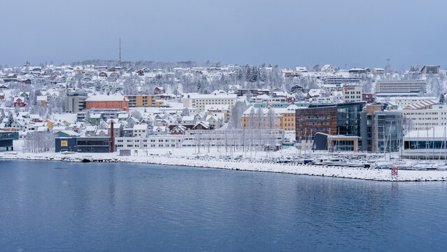 Snow-Covered Troms&oslash; Waterfront and Harbor in Winter