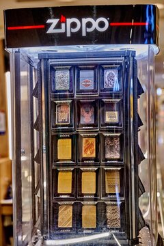 Ambato, Ecuador - June 09, 2025: Zippo lighter display showcasing various designs in Mall de los Andes, highlighting unique craftsmanship and brand heritage with copy space