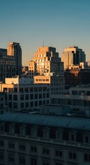 Fototapeta premium Cityscape with tall buildings at sunset.