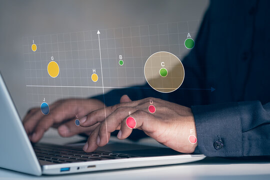Business market positioning analysis, scatter matrix chart on digital interface laptop, finger selecting data point, competitive analysis, product positioning strategy, market research visualization