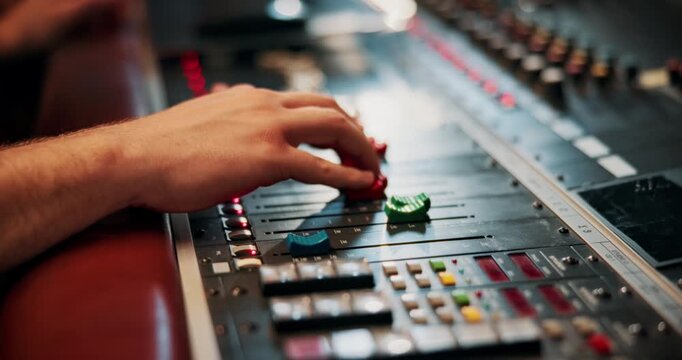Mixing, hands and audio engineer in music studio with equipment, change volume and album production. Man, sound technician and creativity with technology for editing track, project and record label.