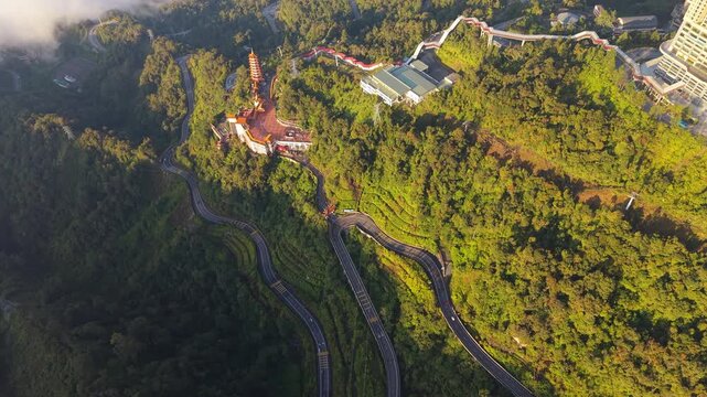 Aerial view of Chin Swee Caves Temple nestled in vast greenery, Malaysia