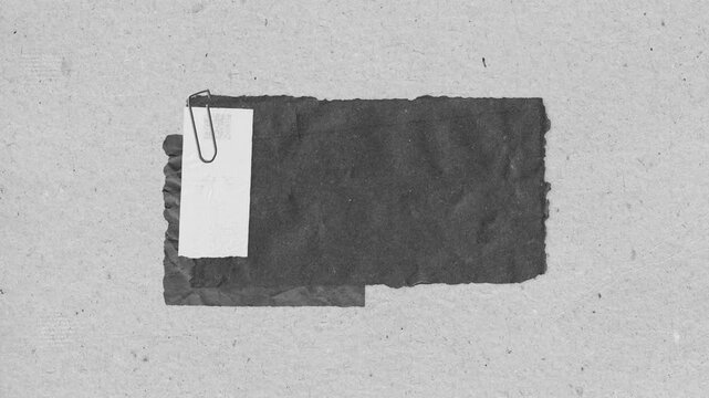 Abstract textured background with paper elements and a paperclip for creative design projects