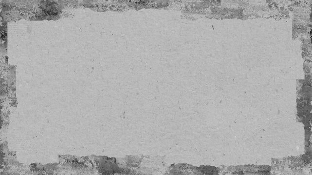 Grunge texture with torn edges in grayscale provides a textured vintage aesthetic for backgrounds