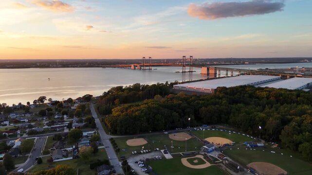 Flying over Pennsville New Jersey community toward Delaware Memorial Bridge at sunset