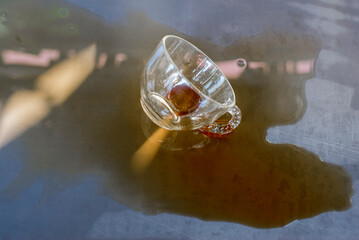 The coffee cup was spilled and scattered. © yongyut