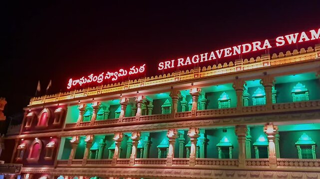 Peaceful night view of Sri Raghavendra Swamy Matha temple illuminated under the dark sky