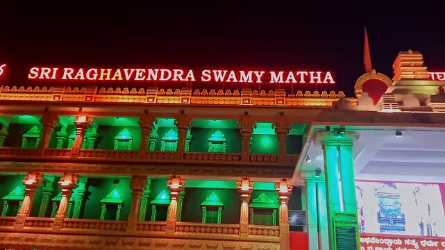 Peaceful night view of Sri Raghavendra Swamy Matha temple illuminated under the dark sky